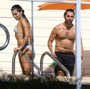 Ева Лонгория (Eva Longoria) wearing a bikini at a pool in Miami December 6-2014 (24xHQ) B793df372188640